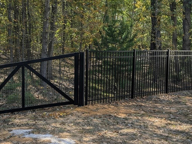 Ornamental Aluminum Fence with Wire Mesh Backing.
